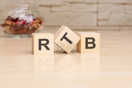 RTB - acronym from wooden blocks with letters, top view on grey background.