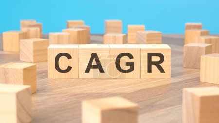 CAGR - acronym is written on wooden blocks. blue background