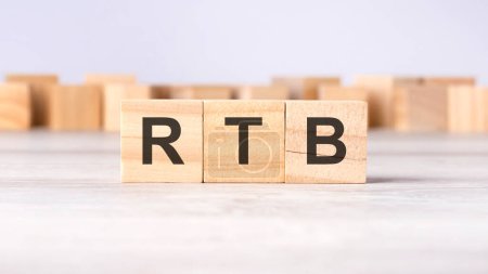 RTB - acronym concept written on wooden cubes or blocks on a light grey background