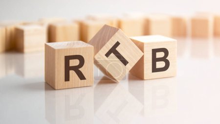 word RTB made with wood building blocks, background may have blur effect