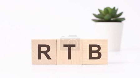 rtb acronym on wooden cubes on white background. business concept