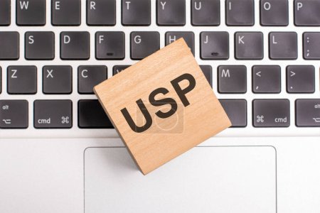 USP inscription concept on wooden block on keyboard