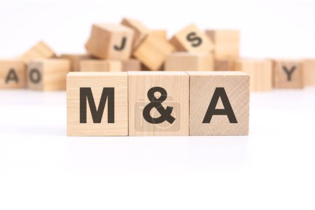 text ma - Mergers and Acquisitions - written on wooden cubes on white background
