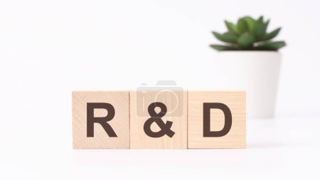 rd acronym on wooden cubes on white background. Research and development business concept