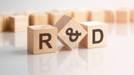 word R and D made with wood building blocks, background may have blur effect
