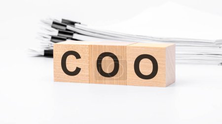 COO wooden cubes word on white background. COO - Chief Operating Officer concepts