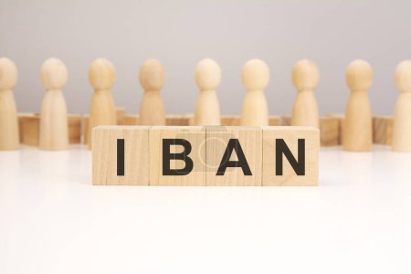 iban - word composed from wooden cubes letters on white background, copy space for text