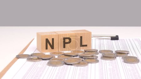 concept emphasized by the image of wooden blocks spelling NPL alongside coins suggests a focus on evaluating and managing non-performing assets to mitigate financial risks and optimize asset quality.