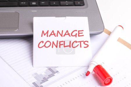 the setup on a white background - a laptop keyboard, red marker, and paper with 'MANAGE CONFLICTS' - evokes focused approach to addressing and resolving conflicts in various settings