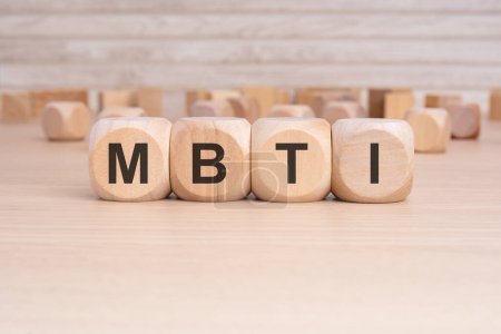 the word MBTI is written on a wooden block. high quality