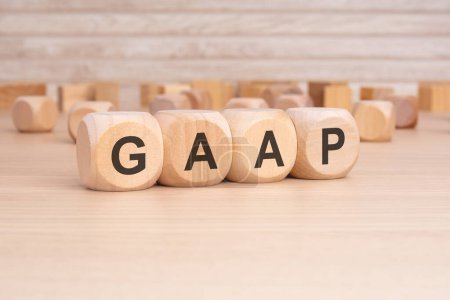 acronym GAAP on a wooden cubes with wooden background. copy space concept. selection focus