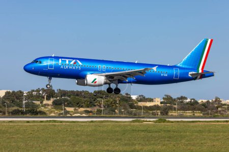 Photo for Luqa, Malta - March 26, 2023: ITA Airways Airbus A320-216 (REG: EI-EIE) landing in splendid sunshine. - Royalty Free Image