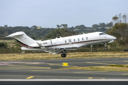 Photo for Luqa, Malta - April 4, 2023: NetJets Bombardier Challenger 350 (BD-100-1A10) (REG: CS-CHC) on take off to Sion Airport, Switzerland - Royalty Free Image