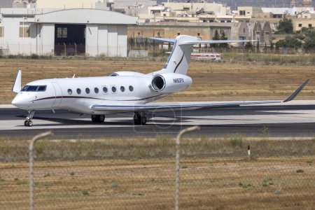 Photo for Luqa, Malta - July 20, 2023: Flexjet Gulfstream G650ER (REG: N663FX) lining up midway runway 31 for take off. - Royalty Free Image