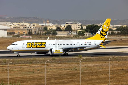 Photo for Luqa, Malta - July 20, 2023: Buzz (Ryanair) Boeing 737-8 MAX 200 (REG: SP-RZB) entering the active runway for take off. - Royalty Free Image
