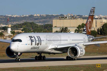 Photo for Luqa, Malta - August 29, 2023: Fiji Airways Airbus A350-941 (REG: DQ-FAN) departing to enter service after being serviced at LTM. - Royalty Free Image
