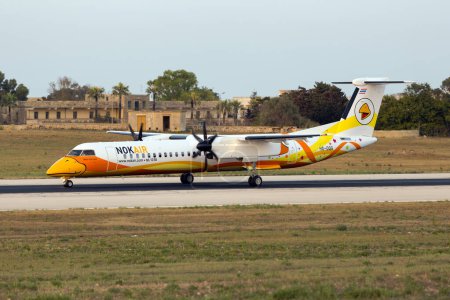 Photo for Luqa, Malta July 11, 2016: Nok Air Bombardier Dash 8-Q402 (REG: HS-DQG) passing through Malta on its delivery flight to the Thai Airline. - Royalty Free Image