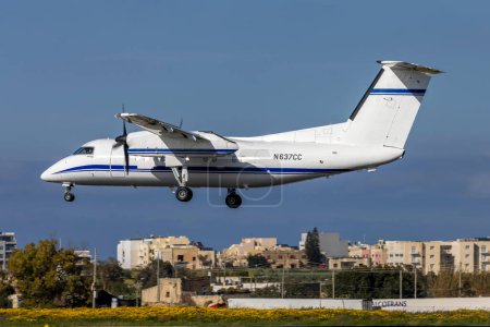 Photo for Luqa, Malta - March 18, 2024: Bombardier DHC-8-200 Dash 8 (REG: N637CC) landing runway 31. - Royalty Free Image