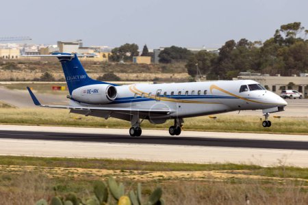 Photo for Luqa, Malta - April 15, 2024: Europ-Star Aircraft GmbH Embraer Legacy 600 (EMB-135BJ) (REG: OE-IRK) landing runway 13. - Royalty Free Image