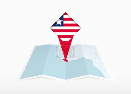 Téléchargez les illustrations : Le Libéria est représenté sur une carte papier pliée et épinglé marqueur de position avec le drapeau du Libéria. - en licence libre de droit
