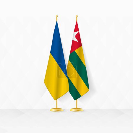 Drapeaux de l'Ukraine et du Togo sur le stand du drapeau, illustration pour la diplomatie et autre rencontre entre l'Ukraine et le Togo.