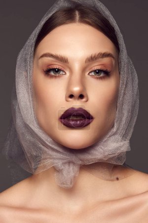 Photo for Independence. Close-up portrait of glamorous female fashion model with artistic makeup expressing emotions over grey background. Style, beauty, high fashion, magazine style and ad - Royalty Free Image
