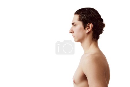Photo for Side view portrait of young man with wet hair posing shirtless isolated over white background. Concept of male beauty, skincare, health, cosmetology, spa, body care. Copy space for ad - Royalty Free Image