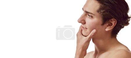 Photo for Portrait of young man after shaving isolated over white background. Mens face cosmetics. Concept of male beauty, skincare, health, cosmetology, spa, body care. Copy space for ad. Flyer - Royalty Free Image