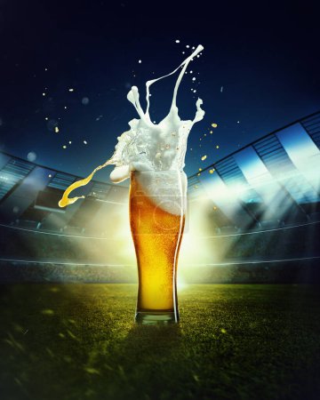 Photo for Foamy splashes. Mug with lager chill beer on grass at football stadium over evening sky with flashlights. Concept of sport, festival, competition, alcohol drinks, match. Copy space for ad. - Royalty Free Image