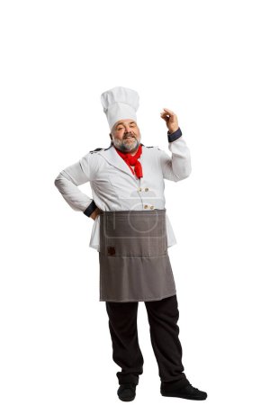 Photo for Portrait of bearded man, restaurant chef in uniform isolated on white background. Delicious, yummy. Professional cook. Concept of profession, occupation, hobby, lifestyle, taste. Ad - Royalty Free Image