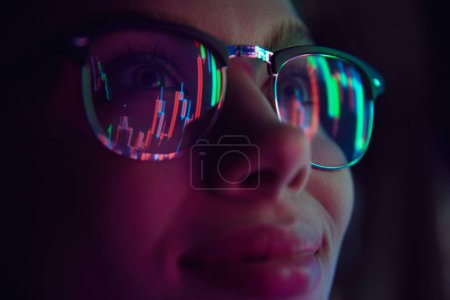 Photo for Close up view of girls eyes in glasses looking at pc screen with computer reflection at eyewear. Using internet, working online, AI, business. Concept of modern technologies, career development - Royalty Free Image