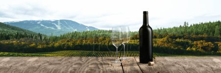 Photo for Bottle and two glasses of delicious white wine standing on wooden table. Beautiful field, forest and mountain landscape in summer. Traditional taste, wine making, degustation concept - Royalty Free Image
