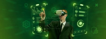 Foto de Young man, employee of IT department, wearing VR glasses and working on virtual holographic computer screen. Modernity. Concept of business, innovative technologies, virtual graphic, simulation - Imagen libre de derechos