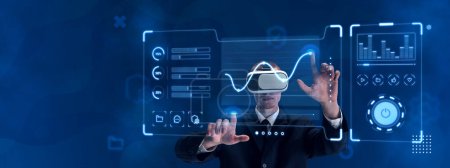 Foto de Man, employee wearing VR glasses and working on virtual holographic computer screen with analytics and data security. Concept of business, innovative technologies, network, virtual graphic, simulation - Imagen libre de derechos
