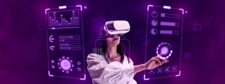 Téléchargez les photos : Woman, employee wearing VR glasses, working on virtual holographic device screen. Making comfortable interface for users. Concept of business, innovative technologies, IT, virtual graphic, simulation - en image libre de droit
