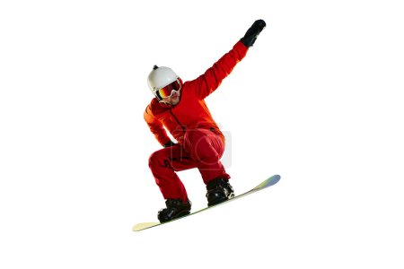 Photo for Portrait of active man, snowboarder in uniform riding on snowboard isolated over white studio background. High jump. Concept of winter sport, action, motion, hobby, leisure time - Royalty Free Image