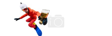 Photo for Portrait of active man, snowboarder in uniform riding on snowboard with beer glass isolated over white studio background. Banner, flyer. Concept of winter sport, action, motion, hobby, leisure time - Royalty Free Image