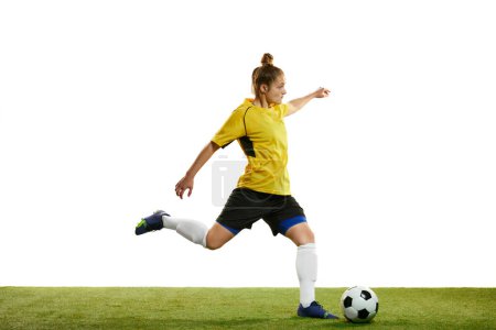Photo for Young woman, professional female football player in motion, training, playing football, soccer isolated over white background. Concept of sport, action, motion, goals, competition, hobby, ad. - Royalty Free Image