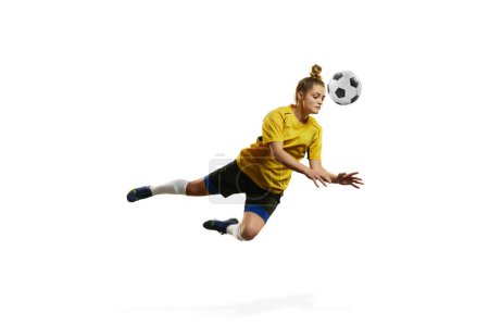 Photo for Hitting ball with head. Young woman, professional female football, soccer player in motion, training, playing isolated over white background. Concept of sport, action, motion, goals, competition - Royalty Free Image