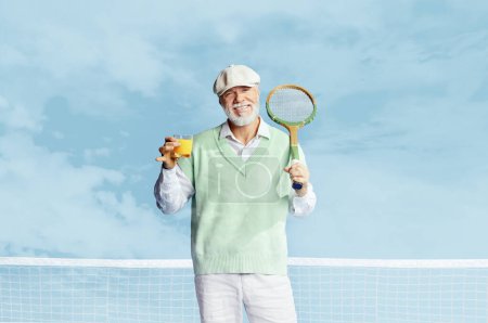 Foto de Portrait of handsome senior man in stylish white outfit posing with tennis racket and fresh juice on sky blue background. Concept of leisure activity, hobby, lifestyle, fitness, emotions, retro style - Imagen libre de derechos