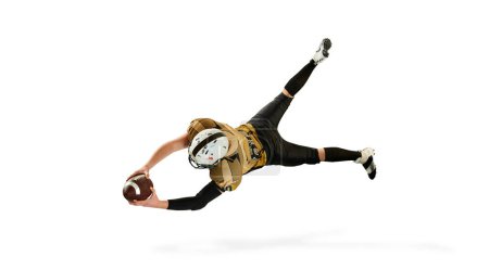 Téléchargez les photos : Flying, catching ball. Man, american football player in motion, training over white studio background. Top view. Concept of sport, movement, achievements, competition, hobby. Copy space for ad - en image libre de droit