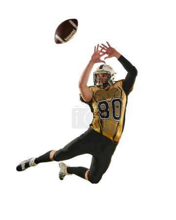 Foto de Man, professional american football player in motion, training, catching ball over white studio background. Concept of sport, movement, achievements, competition, hobby - Imagen libre de derechos