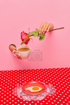 Foto de Food pop art photography. Female hand sticking out pink paper with coffee cup, rose flower. Fried eggs for breakfast. Concept of taste, creativity, art. Complementary colors. Copy space for ad, text - Imagen libre de derechos