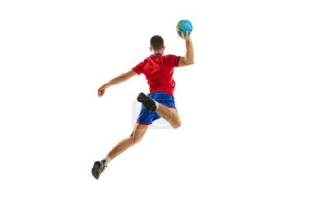 Photo for Back view studio shot of young man, professional handball player training, playing isolated over white background. In motion. Concept of sport, action, motion, championship, sportive lifestyle - Royalty Free Image