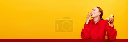 Photo for Brilliant taste of cake. Beautiful young girl in red shirt over yellow studio background. Food pop art photography. Complementary colors. Concept of art, beauty, food. Copy space for ad, text. - Royalty Free Image