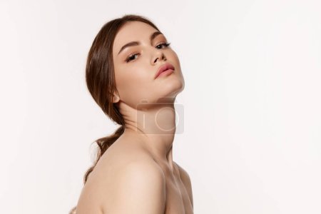 Photo for Portrait of young beautiful woman with perfect smooth skin isolated over white background. Concept of natural beauty, plastic surgery, cosmetology, cosmetics, skin care. Copy space for ad - Royalty Free Image