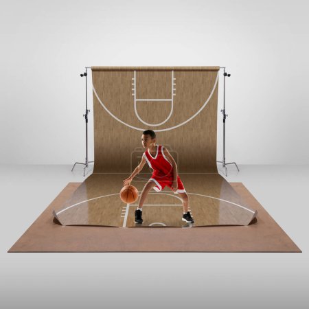 Photo for Teen boy, child, professional basketball player in uniform, training, playing over sports playground background. Concept of art, healthy lifestyle, professional sport, hobby, power and strength - Royalty Free Image