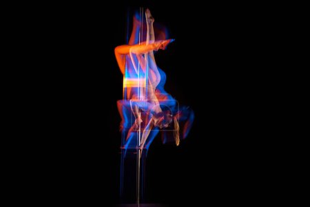 Photo for Gymnastic tricks. Young girl performing pole dance isolated over black studio background with mixed neon lights. Concept of sport and dance, beauty of movements, action, modern style - Royalty Free Image