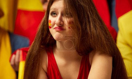 Photo for Close-up image of young girl, football, soccer fans emotionally watching match, worrying about favourite sport team. Bad luck. Concept of sport, cup, world, team, event, competition - Royalty Free Image
