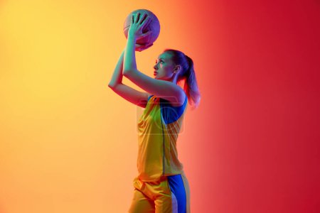 Photo for Winner. Concentrated, motivated female basketball player, young girl during game, posing with ball against white studio background. Concept of professional sport, hobby, healthy lifestyle, motion - Royalty Free Image
